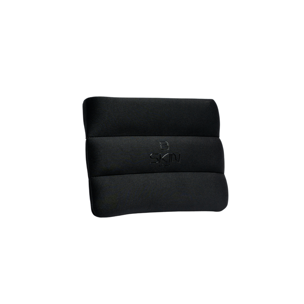 Skin Load Makeup Pouch in black padded neoprene, front view with embossed Skin Load logo
